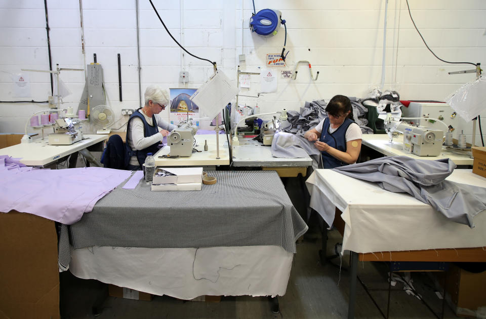  Tibard employees make NHS uniforms at their factory in Dukinfield as the spread of the coronavirus disease (COVID-19) continues, Dukinfield, Britain, April 6, 2020. REUTERS/Molly Darlington