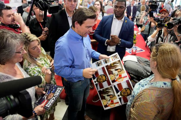 PHOTO: Florida Gov. Ron DeSantis greets audience members during a fundraising picnic for U.S. Rep. Randy Feenstra, R-Iowa, Saturday, May 13, 2023, in Sioux Center, Iowa. (Charlie Neibergall/AP)