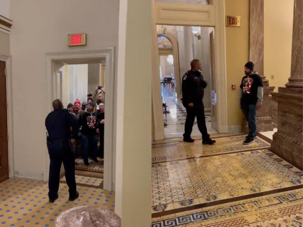 <p>Eugene Goodman aleja a los alborotadores del Capitolio de la cámara del Senado.</p> (Twitter)