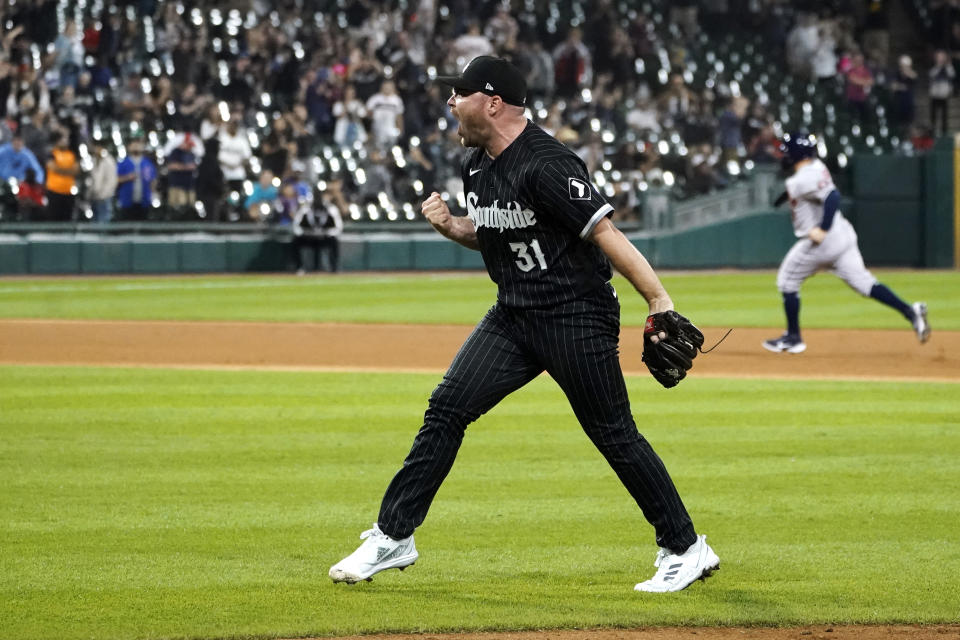 Chicago White Sox relief pitcher Liam Hendriks celebrates the team's 4-2 win over the Houston Astros in a baseball game Monday, Aug. 15, 2022, in Chicago. (AP Photo/Charles Rex Arbogast)