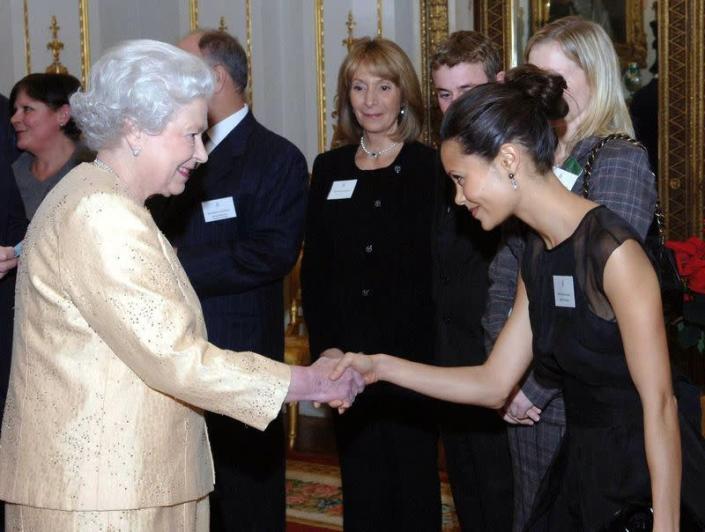<p>British actress Thandie Newton kept things elegant and simple in a little black dress with sheer paneling when meeting Queen Elizabeth at a palace reception. She also seems to have the whole curtsy thing down pat.</p>