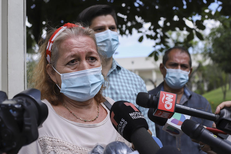 Rosibel Emerita Arriaza, the mother of Victoria Esperanza Salazar who died in police custody, talks to the press in Antiguo Cuzcatlan, El Salvador, Monday, March 29, 2021. Mexican authorities said Monday that an autopsy of Arriaza's daughter confirmed that police broke her neck in the Caribbean resort of Tulum, Mexico. (AP Photo/Salvador Melendez)