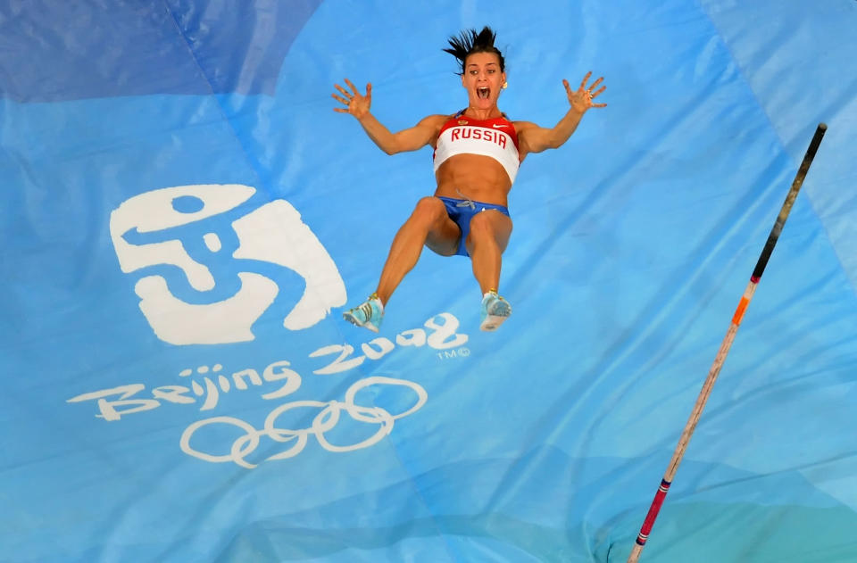 Elena Isinbaeva of Russia celebrates successfully jumping a new World Record of 5.05 in the Women's Pole Vault Final at the National Stadium on Day 10 of the Beijing 2008 Olympic Games on August 18, 2008 in Beijing, China. (Photo by Harry How/Getty Images)