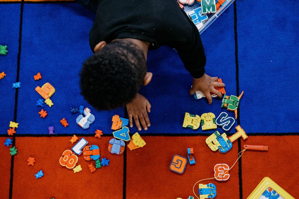 Makenzie Andrew, 4, sanitizes her hands in Aletha Darby’s Great Start Readiness Program classroom at Growing Minds Learning Center on May 24, 2022 in Detroit.