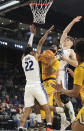 Long Beach State guard Marcus Tsohonis (0) collides between UC Davis' Sione Lose (22) and Niko Rocak (20) during the first half of an NCAA college basketball game in the championship of the Big West Conference men's tournament Saturday, March 16, 2024, in Henderson, Nev. (AP Photo/Ronda Churchill)
