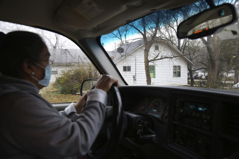 Tyson Foods employee, Silvia De Leon, drives home from a local food pantry at the Community Baptist Church of Noel, in Noel, Mo., on Saturday, Nov. 21, 2020. De Leon contracted COVID-19 at the end of June and was out of work for several weeks. She has utilized the pantry every Saturday for the past five months as she and her retired husband pay off coronavirus related medical bills. "If it weren't for this, I don't know what I'd do," said De Leon. (AP Photo/Jessie Wardarski)