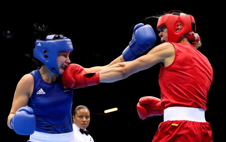 LONDON, ENGLAND - AUGUST 05: Anna Laurell of Sweden (R) in action with Naomi-Lee Fischer-Rasmussen of Australia during the Women's Middle (69-75kg) Boxing on Day 9 of the London 2012 Olympic Games at ExCeL on August 5, 2012 in London, England. (Photo by Scott Heavey/Getty Images)