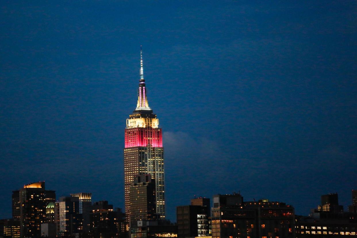 New York's Empire State Building was lit up in Qatar's national colours white and burgundy to mark 10 years of Qatar Airways flights to the US on Tuesday 27 June: Getty