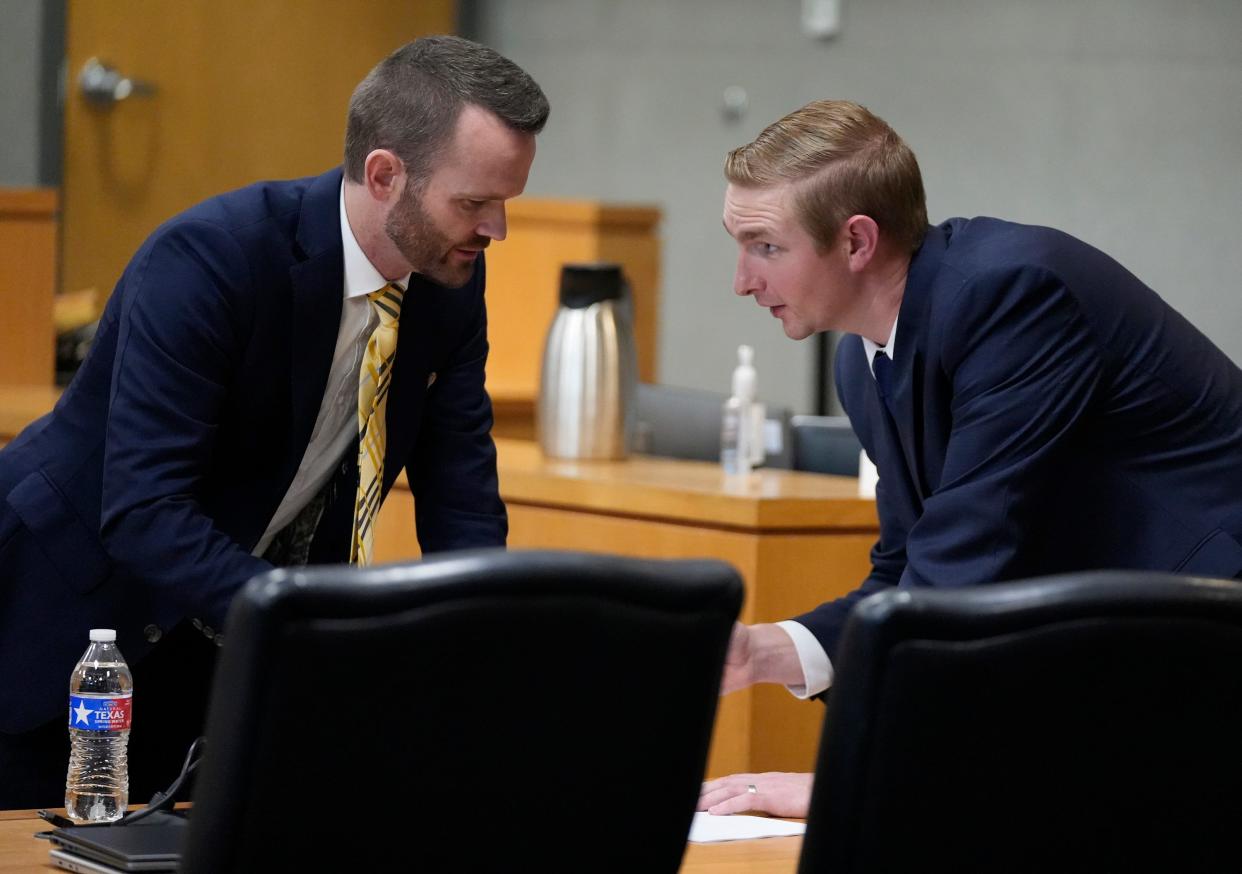 Austin police officer Christopher Taylor, right, speaks Nov. 7 to his defense attorney Ken Ervin at the end of closing arguments of his trial in the fatal shooting of Michael Ramos.