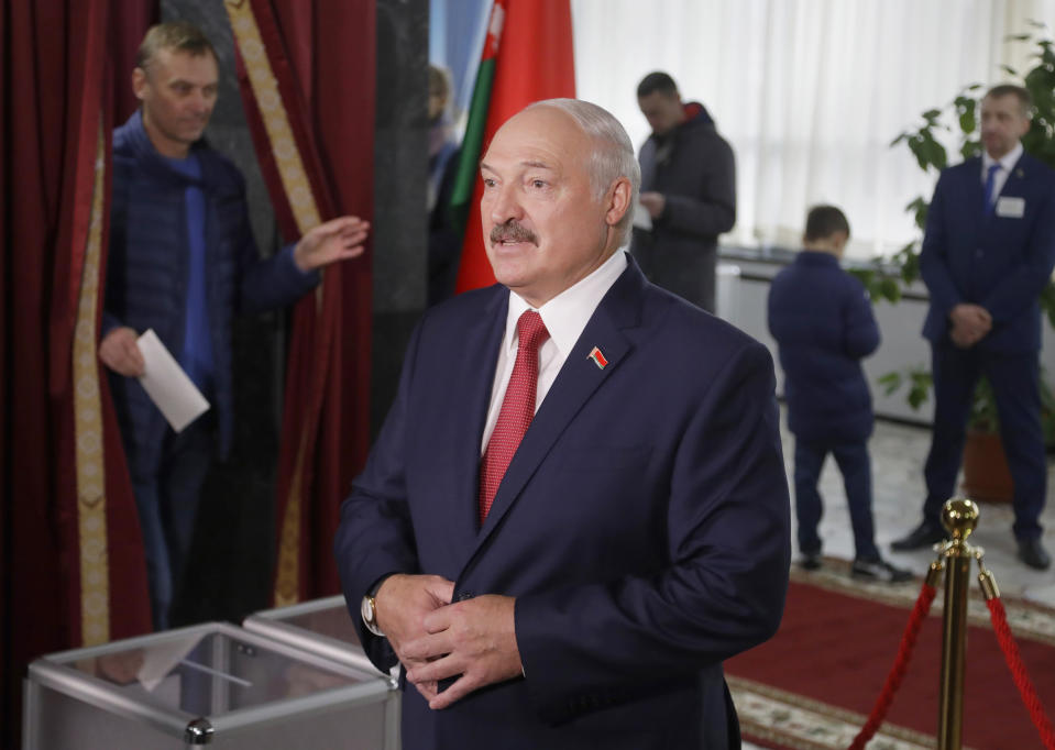 Belarusian President Alexander Lukashenko speaks to the media after voting at a polling station during parliamentary elections, in Minsk, Belarus, Sunday, Nov. 17, 2019. (AP Photo/Sergei Grits)