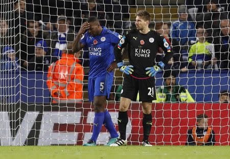 Britain Football Soccer - Leicester City v West Bromwich Albion - Premier League - King Power Stadium - 6/11/16 Leicester City's Ron-Robert Zieler and Leicester City's Wes Morgan looks dejected after West Bromwich Albion's Matt Phillips scored their second goal Reuters / Darren Staples