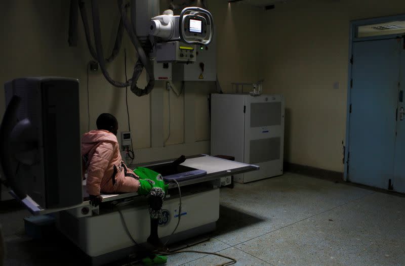 A child waits to be examined with a digital X-Ray machine at the Kenyatta National Hospital in Nairobi
