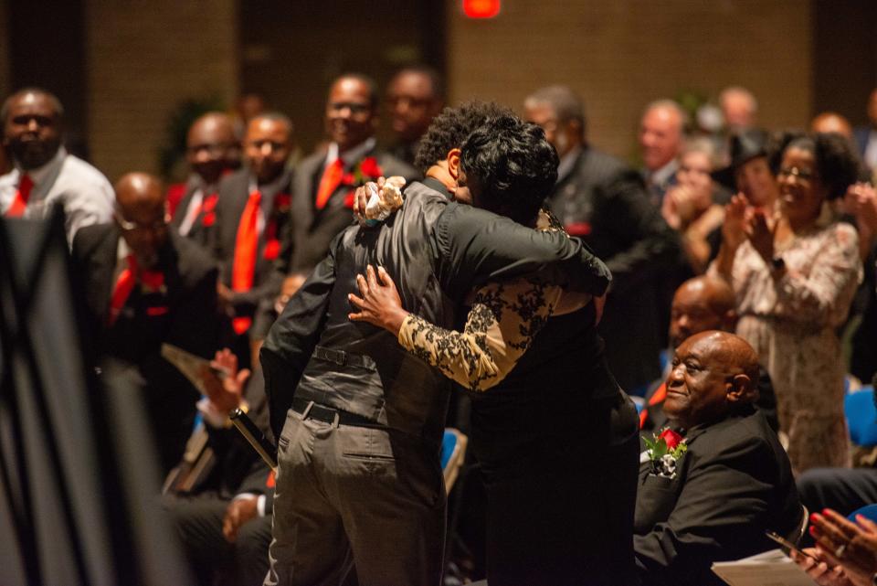 Damien Pearson, cousin to Shirlene, hugs Tina Mercer after his performance during Shirlene Mercer's funeral service inside Carl Perkins Civic Center on Wednesday, Aug. 9, 2023.