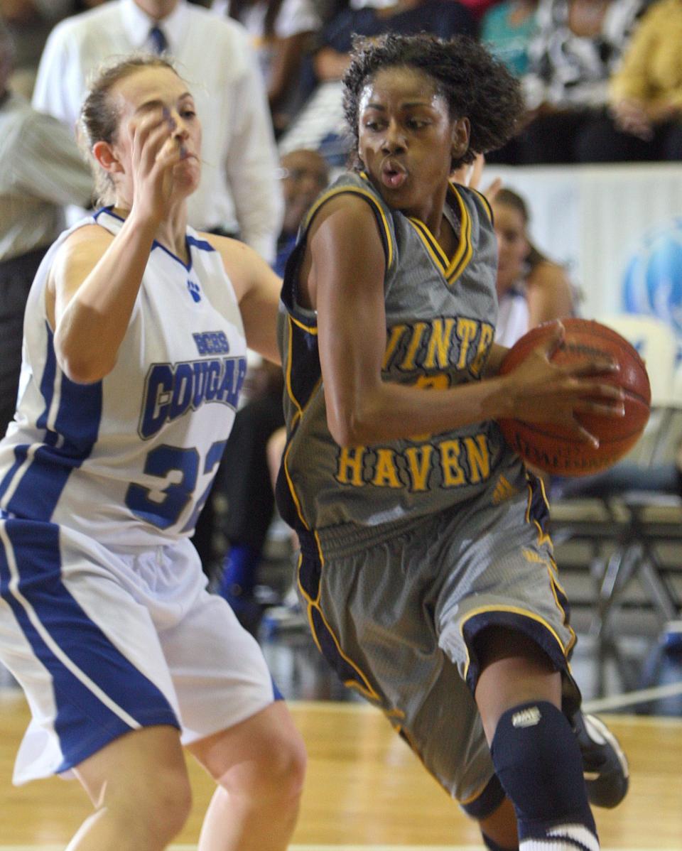 Winter Haven High School's Tiffany Hayes (3) drives toward the basket as Barron Collier High School's Erin Zampell tries to defend during their FHSAA 5-A Girls Basketball championship game at the Lakeland Center Friday night. Barron Collier won the game 33-30. February 22, 2008. The Ledger/Michael Wilson