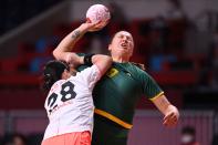 <p>Montenegro's left back Durdina Jaukovic (R) is challenged during the women's preliminary round group A handball match between Japan and Montenegro of the Tokyo 2020 Olympic Games at the Yoyogi National Stadium in Tokyo on July 27, 2021. (Photo by Daniel LEAL-OLIVAS / AFP)</p> 