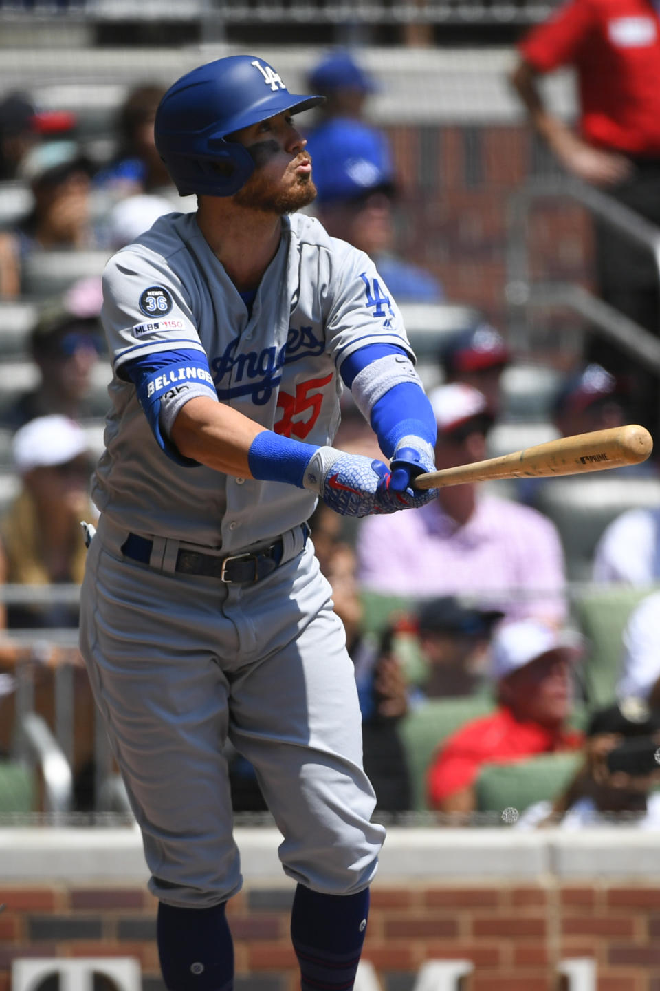 Los Angeles Dodgers' Cody Bellinger watches his three-run home run sail over center field during the first inning of a baseball game against the Atlanta Braves, Sunday, Aug. 18, 2019, in Atlanta. (AP Photo/John Amis)