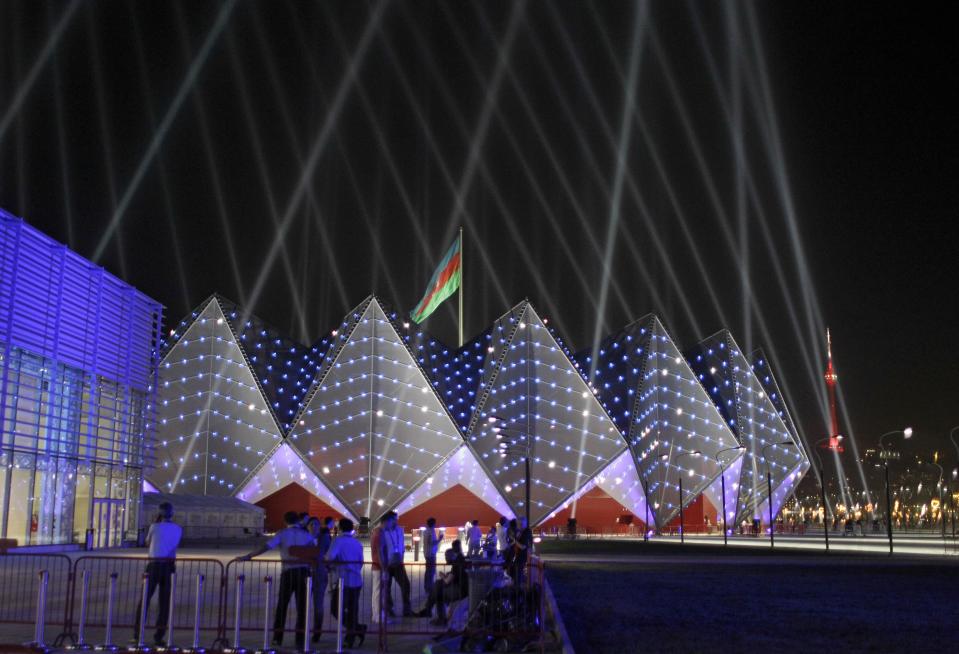 The Baku Crystal Palace is lit by lights during the rehearsals for the 2012 Eurovision Song contest in Baku, Tuesday, May 22, 2012. The capital of this former Soviet republic has shed its dour, industrial image and evolved into a vibrant metropolis combining the old world charms of Istanbul with the architectural ostentations of Dubai. Now it has the perfect stage to show off its decade-long transformation: the Eurovision Song contest. (AP Photo/Sergey Ponomarev)