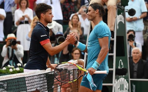 Nadal shakes hands with Thiem at the net - Credit: AFP