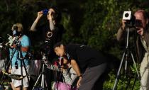 Spectators view the total solar eclipse on November 14, 2012 in Palm Cove, Australia.