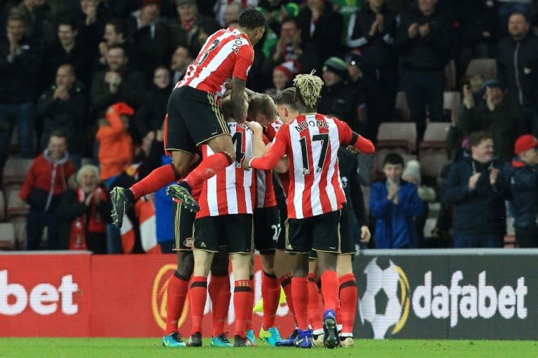 Sunderland players celebrate after a header from Jan Kirchhoff caused Leicester City's Robert Huth to score an own-goal on December 3, 2016