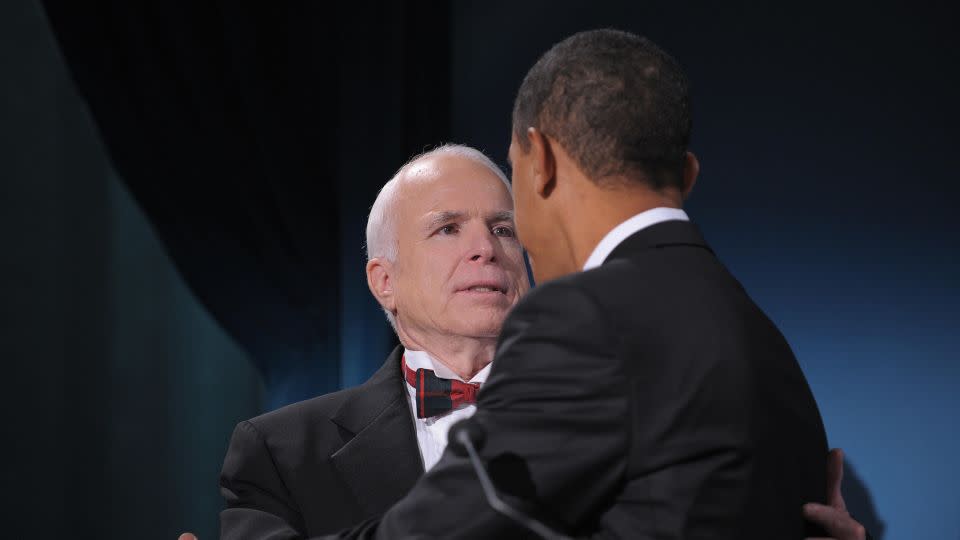 US President-elect Barack Obama greets Arizona Senator John McCain, the former Republican presidential candidate, during a bipartisan dinner in McCain's honor on January 19, 2009, in Washington on the night before Obama's inauguration. - Mandel Ngan/AFP/Getty Images