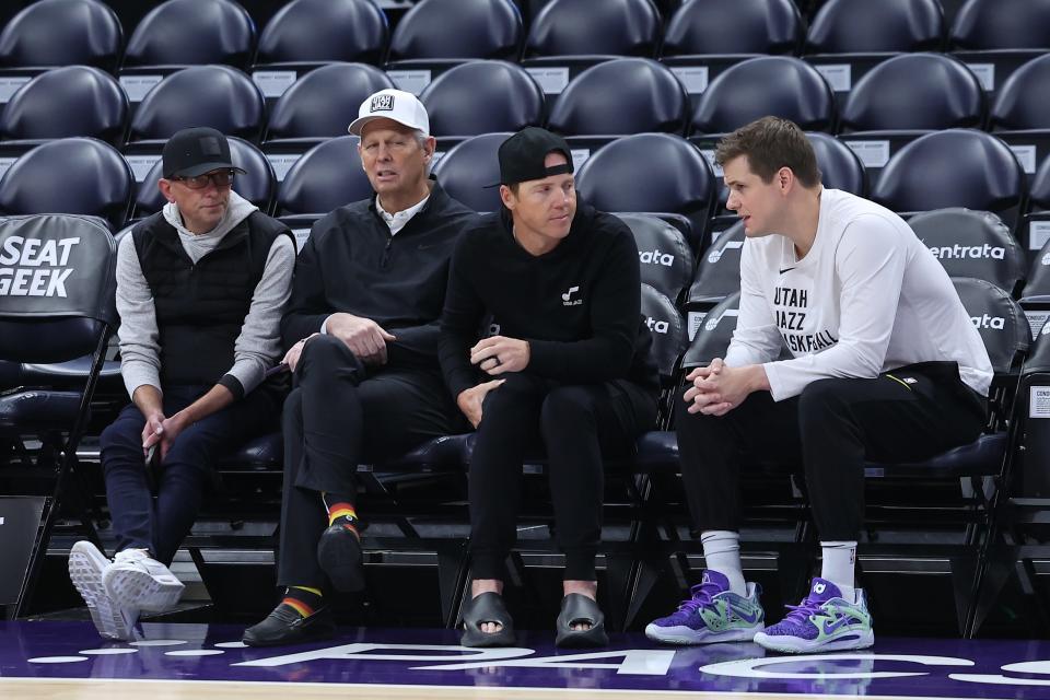 From left to right, Utah Jazz GM Justin Zanik, CEO Danny Ainge, owner Ryan Smith and head coach Will Hardy sit court side before a game against the Oklahoma City Thunder at Delta Center.