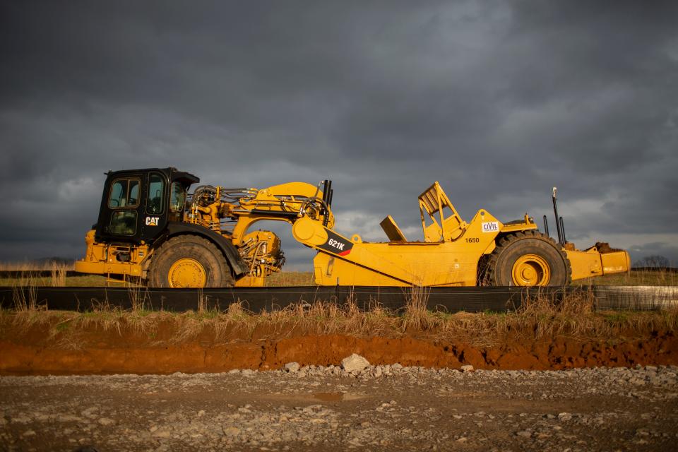 Construction equipment rests at the site of the June Lake development in Spring Hill, Tenn., following a storm on Monday, March 7, 2022.