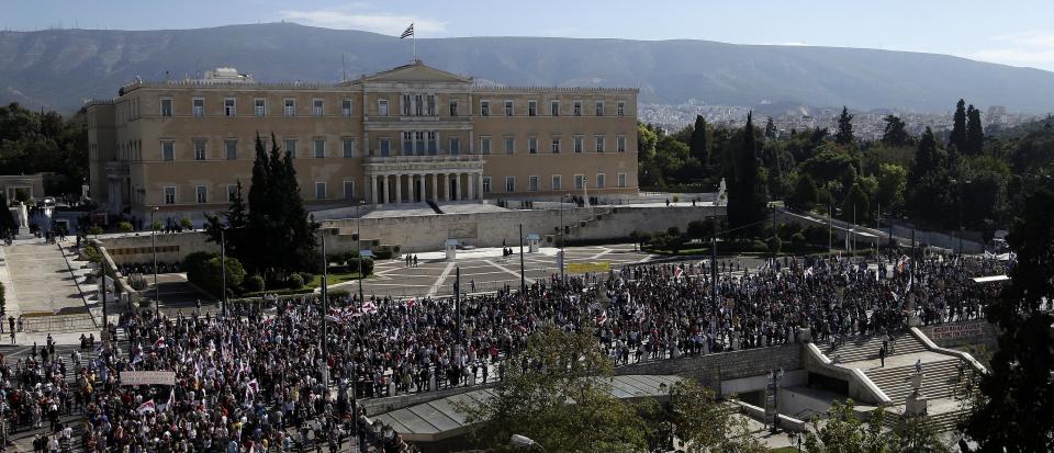 Protesters gather in front of the Greek Parliament in Athens on Tuesday Nov. 6, 2012. Greece's unions are holding their third general strike in six weeks to press dissenters in the country's troubled coalition government not to back a major new austerity program that will doom Greeks to further hardship in a sixth year of recession. Two days of demonstrations are planned to start Tuesday, continuing until lawmakers vote late Wednesday on the bill to slash euro 13.5 billion ($17.3 billion) from budget spending over two years. (AP Photo/Dimitri Messinis)