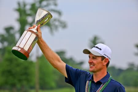 Justin Rose holds up the Zurich Classic championship trophy following his win in the final round of the Zurich Classic at TPC Louisiana. Derick E. Hingle-USA TODAY Sports