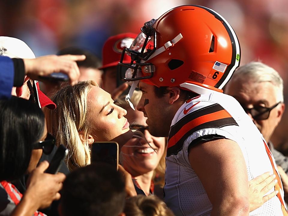 Baker Mayfield #6 of the Cleveland Browns kisses Emily Wilkinson before the game against the Francisco 49ers at Levi's Stadium on October 07, 2019 in Santa Clara, California