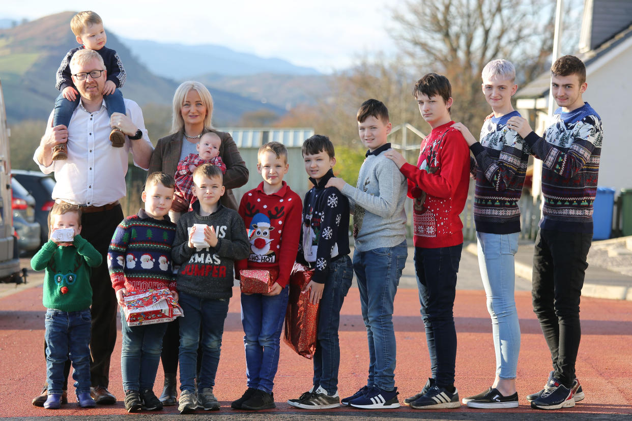 PIC BY CATERS NEWS (PICTURED The Brett family from Dingwall, Dad Davie with Rothagaide on his shoulders and mum Alexis with baby Cameron, boys L-R Blake, Mack, Hunter, Brahn, Brodie, Lachlan, Corey, Harrison and Campbell.) A family of ten boys - who finally welcomed a little sister this year - have revealed how they manage to work their way round what should be a chaotic Christmas. Alexis and David Brett start prepping for their next years Christmas the moment they've finished celebrating the big day - as this time of year leads to a house full of excitement and lots of questions regarding Santa. Only four months on from the birth of their first girl, Cameron, the family are preparing for their biggest Christmas yet. Alexis and her husband David, 45, a train driver, who also suffers from early onset Parkinson's Disease, admitted they were nervous about having a girl after so many years of boys, at first - but the little one has slotted right into the family home in Iverness, Scotland. SEE CATERS NEWS 