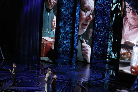 90th Academy Awards - Oscars Show - Hollywood, California, U.S., 04/03/2018 - Gary Oldman (L) accepts the Oscar for Best Actor for "Darkest Hour." REUTERS/Lucas Jackson