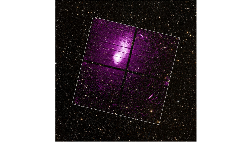 A purple galaxy cluster is seen in space.  A white box indicates the main area.