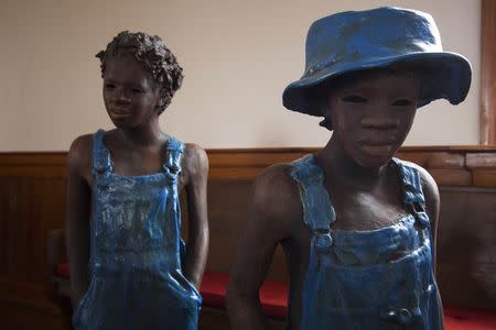 Terra-cotta statues of child slaves inside of a church at the Whitney Plantation in Wallace, Louisiana on January 13, 2015. REUTERS/Edmund Fountain