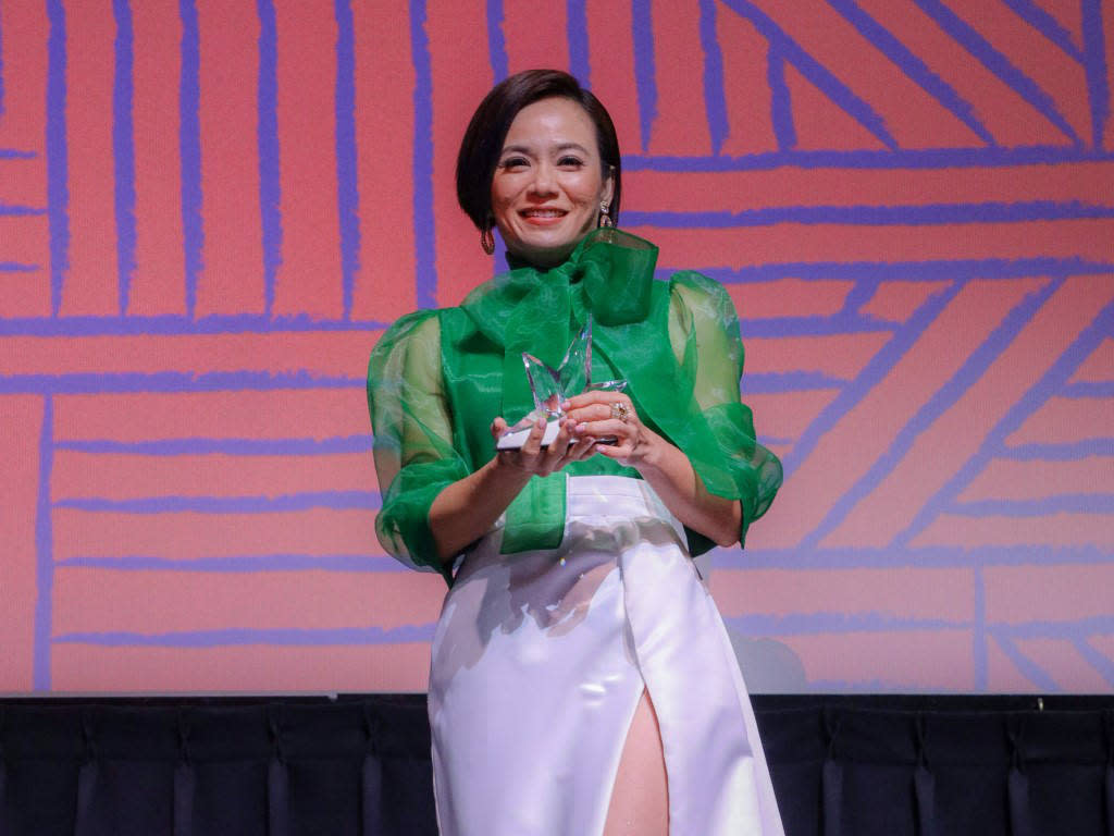 Malaysian actress Yeo Yann Yann poses with her Inspiring Woman in Film Award.