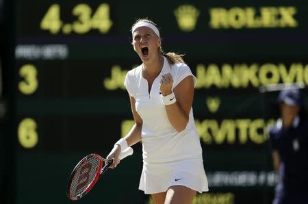Petra Kvitova of the Czech Republic celebrates breaking serve during her match against Jelena Jankovic of Serbia at the Wimbledon Tennis Championships in London, July 4, 2015. REUTERS/Henry Browne