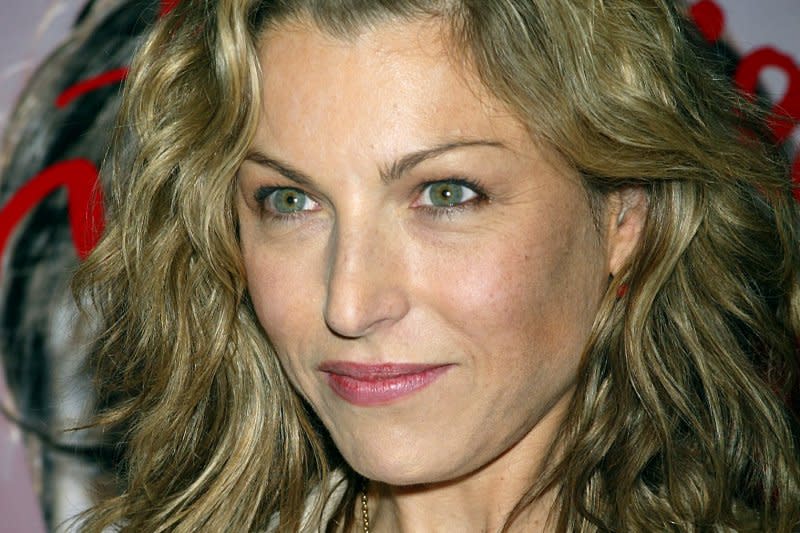 Tatum O'Neal poses for pictures at the premiere of "Motorcycle Diaries" at Loews 19th Street Theater in New York in 2004. File Photo by Laura Cavanaugh/UPI