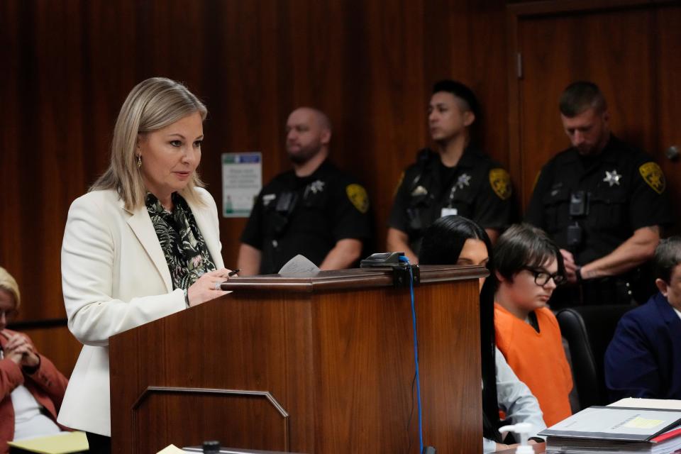 Oakland County Prosecutor Karen McDonald proceeds with an opening statement as defendant Ethan Crumbley, right, listens on Thursday, July 27, 2023, in Pontiac, Mich. Oakland County judge Kwame Rowe is hearing evidence starting Thursday to help him decide whether the teen who killed four students and injured six others and a teacher in November 2021 at Oxford High School should be sentenced to prison without the chance of parole.