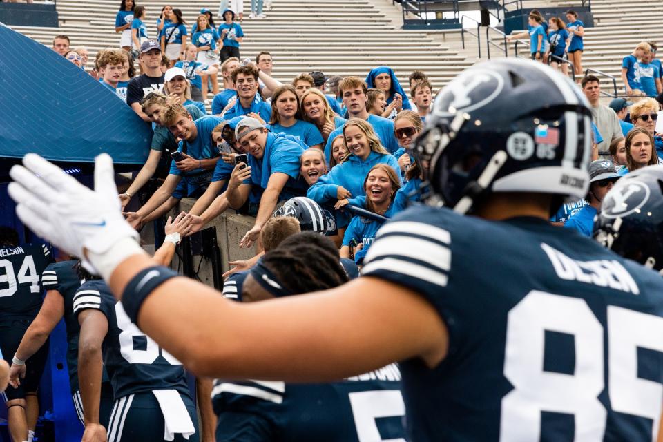 Fans high-five members of the Brigham Young Cougars football team after their 41-16 victory over the Southern Utah Thunderbirds at LaVell Edwards Stadium in Provo on Saturday, Sept. 9, 2023. | Megan Nielsen, Deseret News