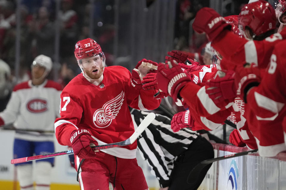 Detroit Red Wings left wing J.T. Compher (37) celebrates his goal against the Montreal Canadiens in the third period of an NHL hockey game Thursday, Nov. 9, 2023, in Detroit. (AP Photo/Paul Sancya)