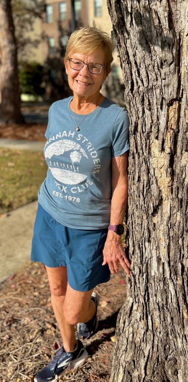 Avid runner Sherry Feathers poses in her Savannah Striders Track Club shirt. She will be running in her 15th United Way Turkey Trot race on Thanksgiving Day