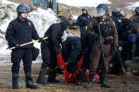 Police detain Ricardo Salazar, 25, of San Bernardino, California, in the main opposition camp against the Dakota Access oil pipeline near Cannon Ball, North Dakota, U.S., February 23, 2017. REUTERS/Terray Sylvester