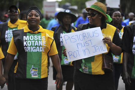 Members of the ruling African National Congress (ANC) Women's League march in Pretoria on the anniversary of the killing of Reeva Steenkamp, February 14, 2014. REUTERS/Stringer