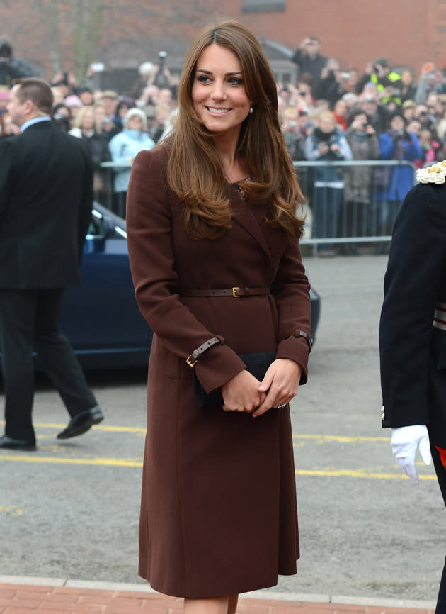 Kate Middleton showed off her baby bump in this gorgeous chocolate brown coat dress during a royal engagement in Grimsby. Copyright [Splash]