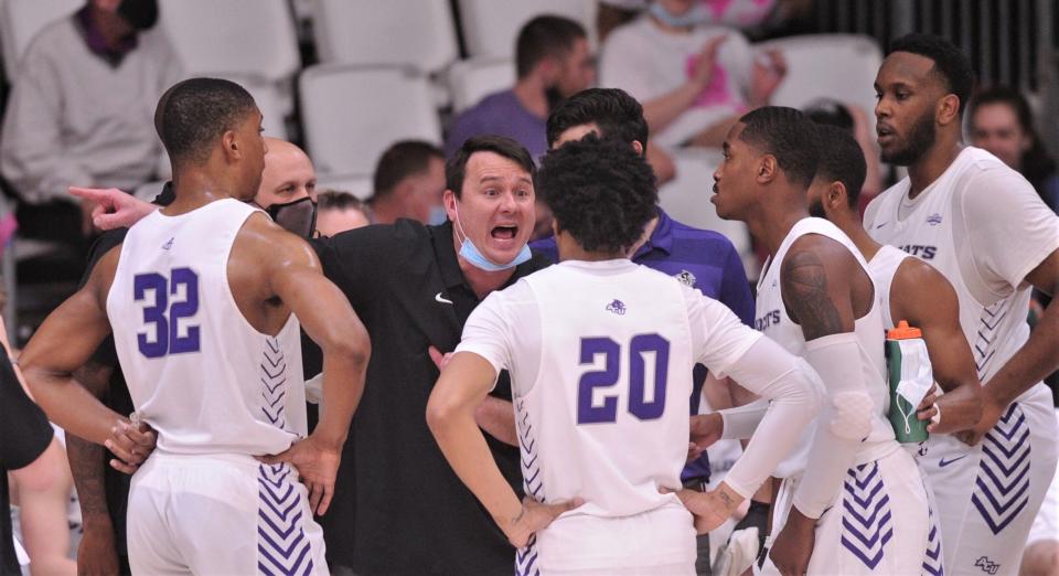 ACU coach Joe Golding talks to his team during a timeout against Sam Houston State. ACU beat the Bearkats 86-72 in the Southland Conference game Feb. 24, 2021 at the Teague Center.