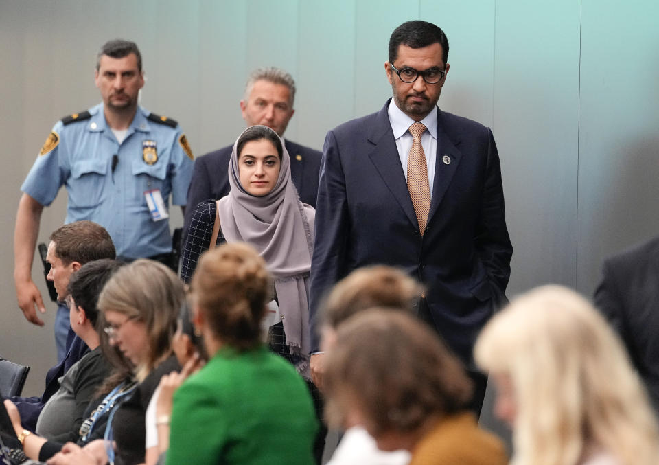 Sultan al-Jaber, who will preside over the next UN global climate summit in Dubai, right, leaves a meeting at the United Nations Climate Change Conference in Bonn, Germany, Thursday, June 8, 2023. Al-Jaber said he wants the COP28 summit in Dubai to be "inclusive" and deliver a “game-changing outcome” for international efforts to tackle climate change. (AP Photo/Martin Meissner)