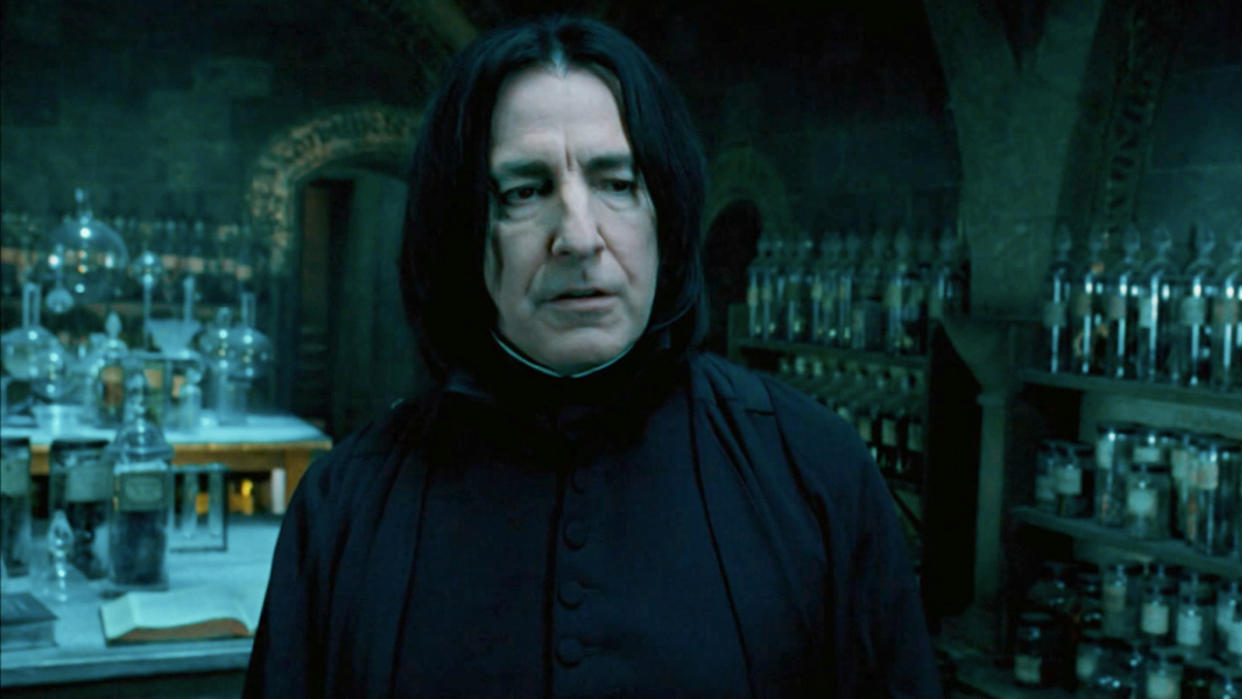  Alan Rickman stands frustrated, amid a variety of potion bottles, in Harry Potter and the Order of the Phoenix. 