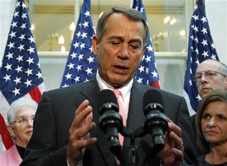 U.S. House Speaker John Boehner (R-OH) (C) addresses reporters at the U.S. Capitol in Washington, October 10, 2013. REUTERS/Jonathan Ernst