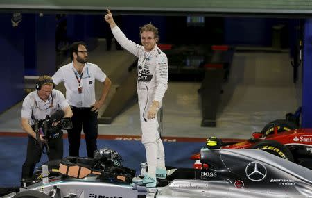 Mercedes Formula One driver Nico Rosberg of Germany celebrates after winning the Abu Dhabi F1 Grand Prix at the Yas Marina circuit in Abu Dhabi November 29, 2015. REUTERS/Hamad I Mohammed