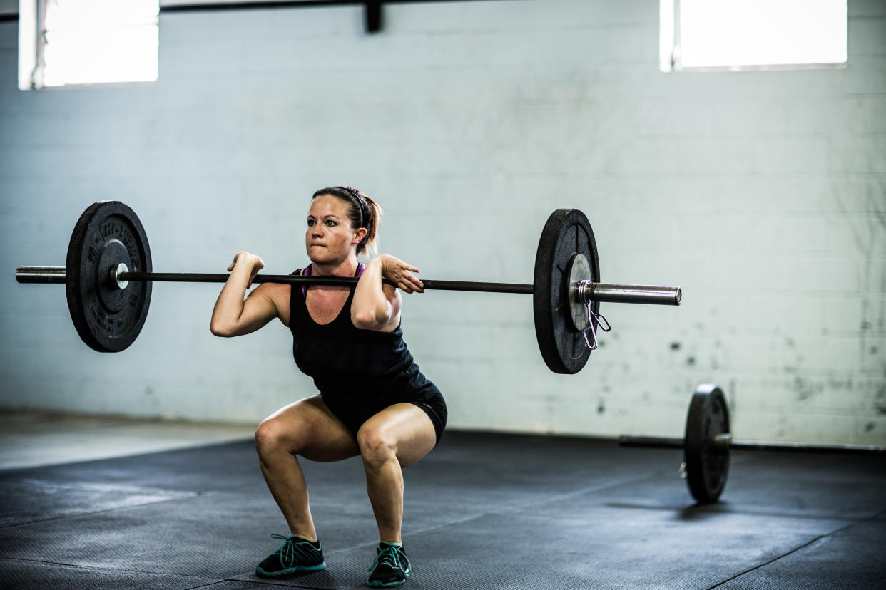 Women lifting weights. (Getty Images)